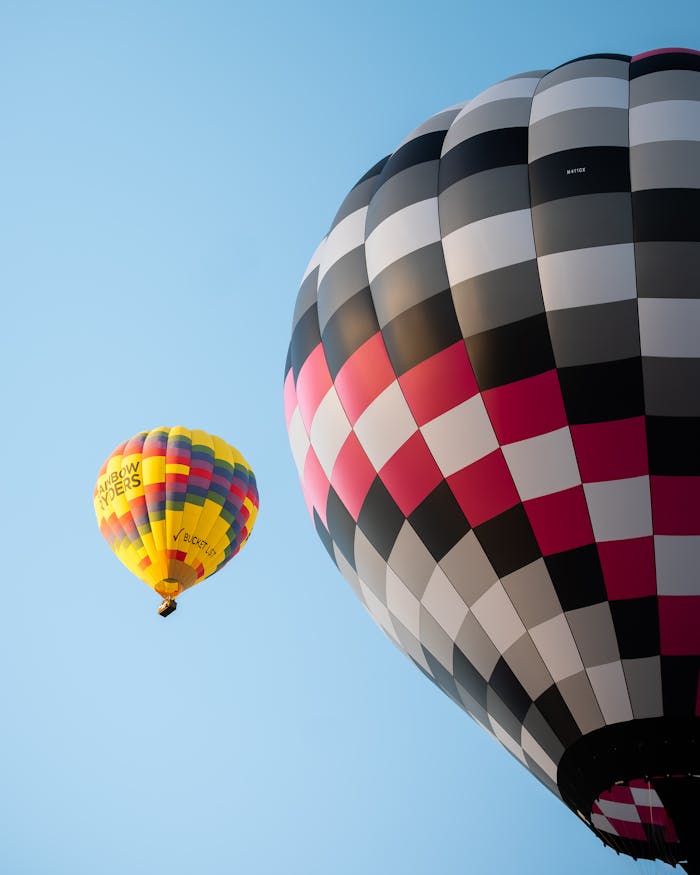 Vibrant hot air balloons against clear blue sky at Albuquerque's famous festival.